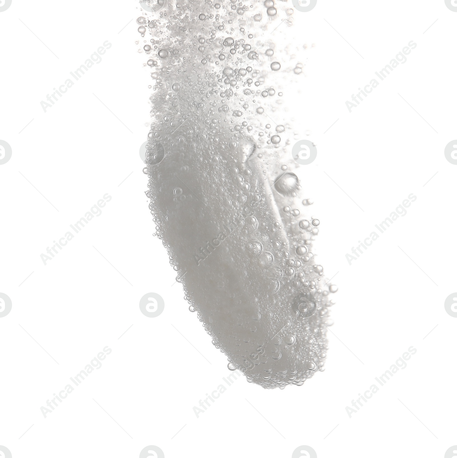 Photo of Effervescent pill dissolving in water on white background, closeup