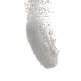 Photo of Effervescent pill dissolving in water on white background, closeup