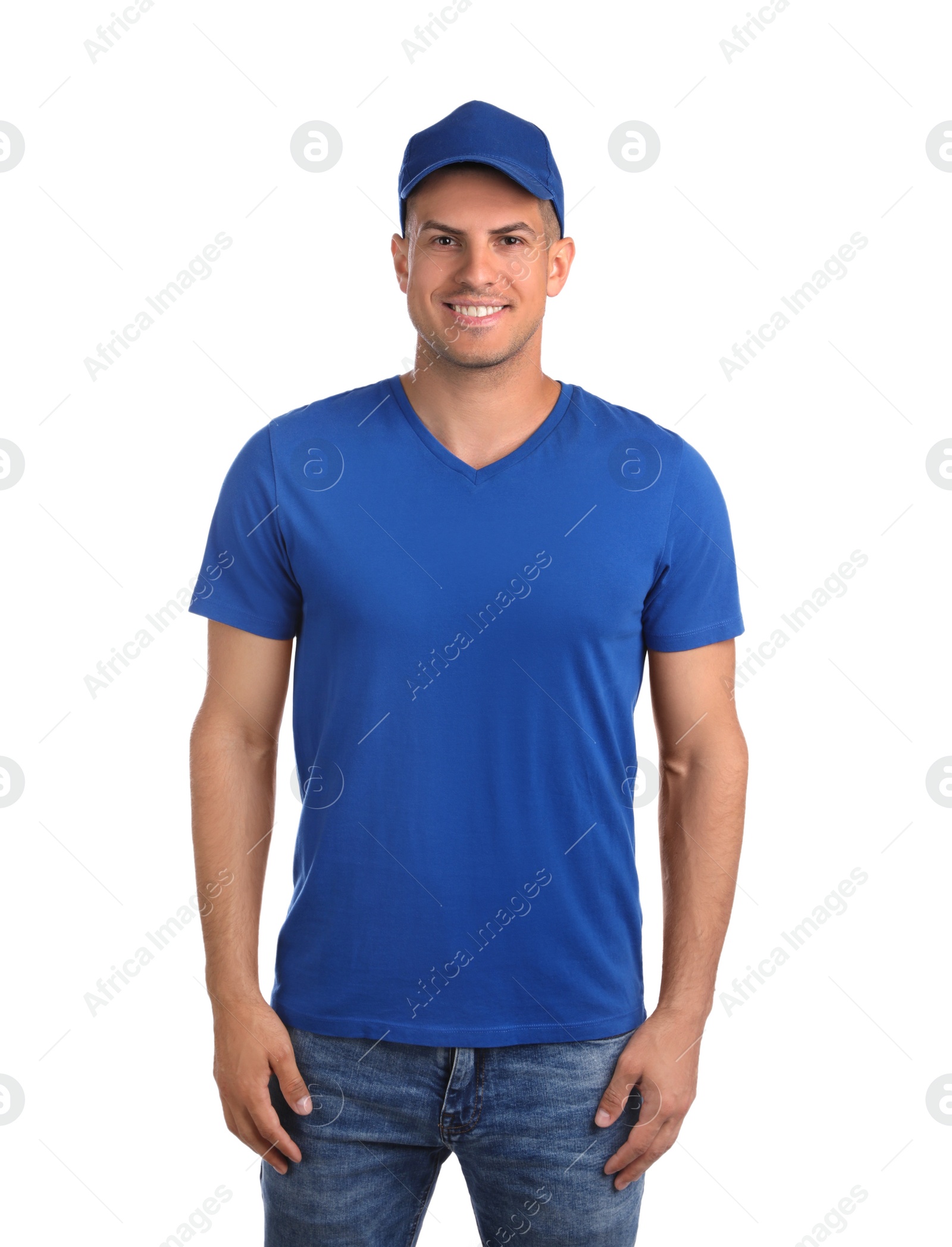 Photo of Happy man in blue cap and tshirt on white background. Mockup for design