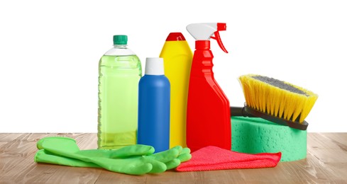 Many different car wash products on wooden table against white background