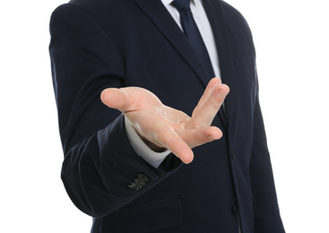 Businessman showing something against white background, focus on hand
