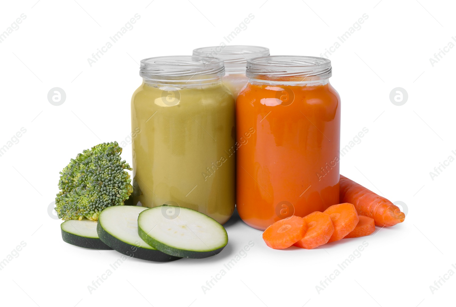 Photo of Jars of healthy baby food and fresh vegetables on white background