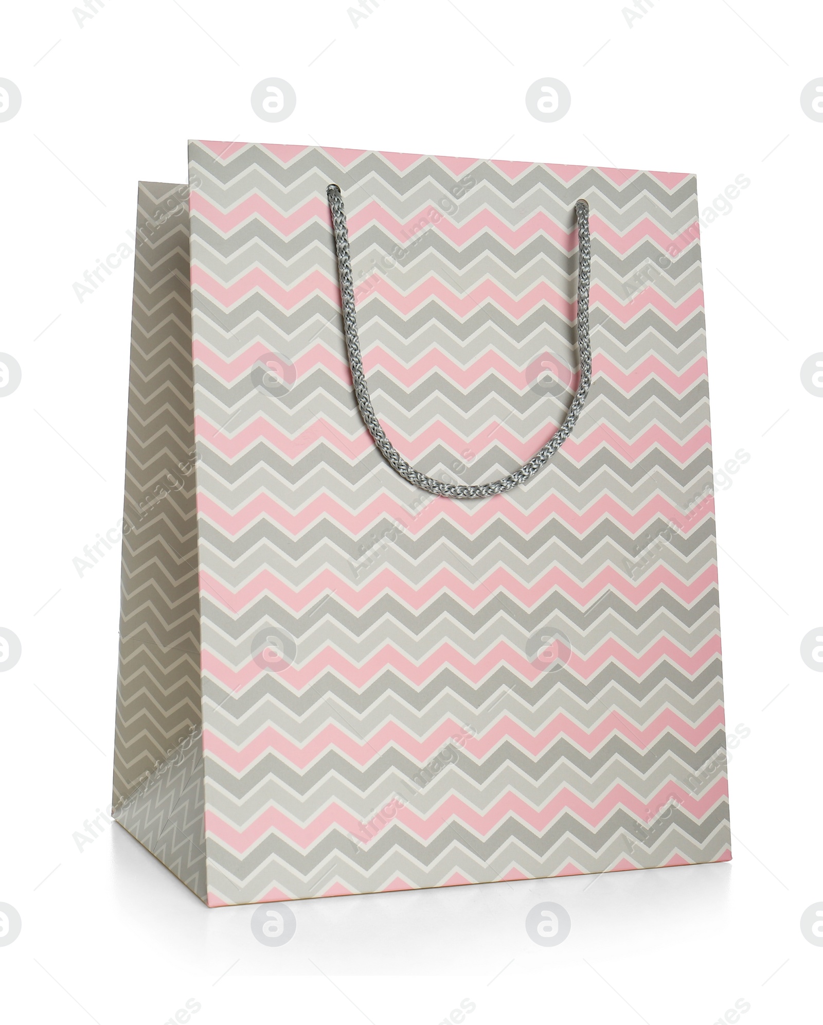 Photo of Stylish gift paper bag isolated on white