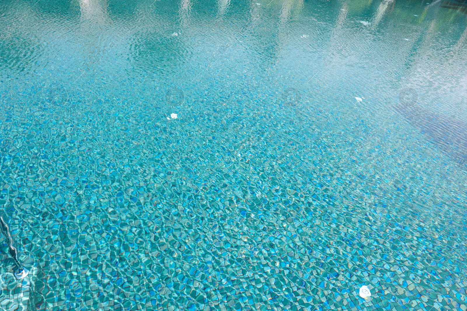 Photo of Clear water with ripples in swimming pool outdoors