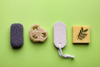 Photo of Flat lay composition with pumice stones on light green background