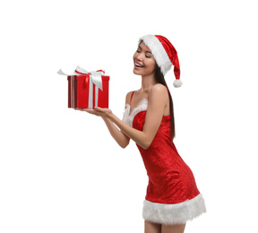 Photo of Beautiful Asian woman in Santa costume with Christmas gift on white background