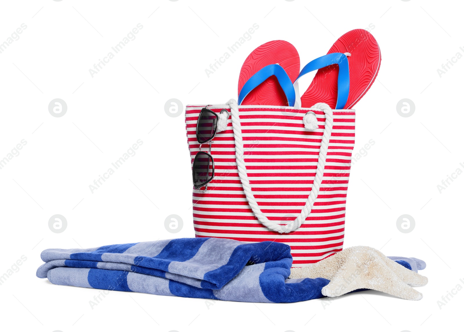 Photo of Stylish bag, starfish and other beach accessories isolated on white