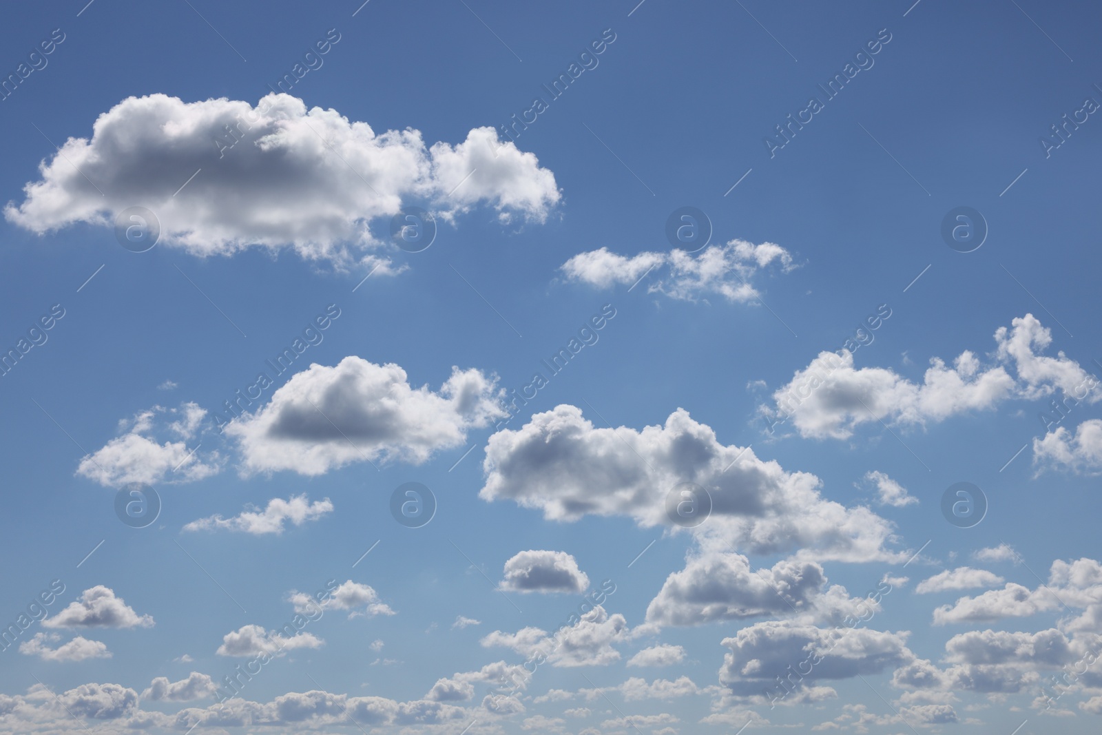 Photo of Beautiful white fluffy clouds in blue sky