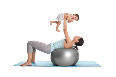 Photo of Young woman doing exercise with her son isolated on white. Time for fitness