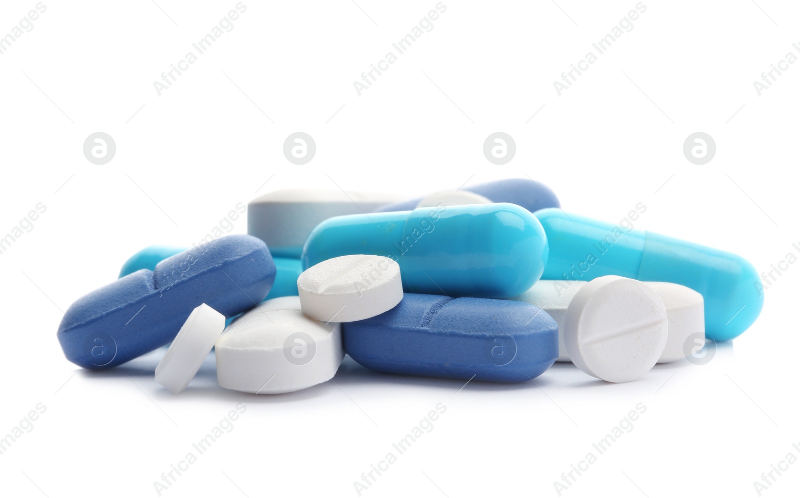 Photo of Pile of different pills on white background