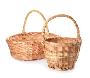 Photo of Two decorative wicker baskets on white background