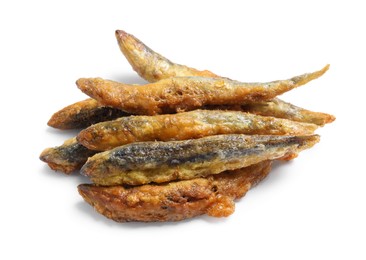 Photo of Pile of delicious fried anchovies on white background
