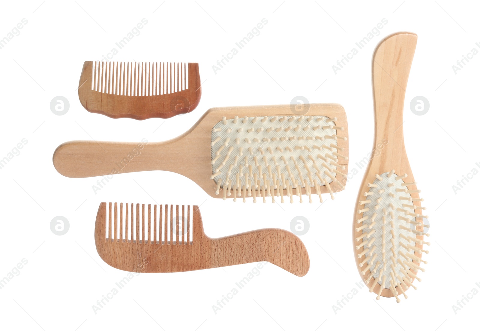 Photo of Different wooden hair brushes and combs on white background, top view