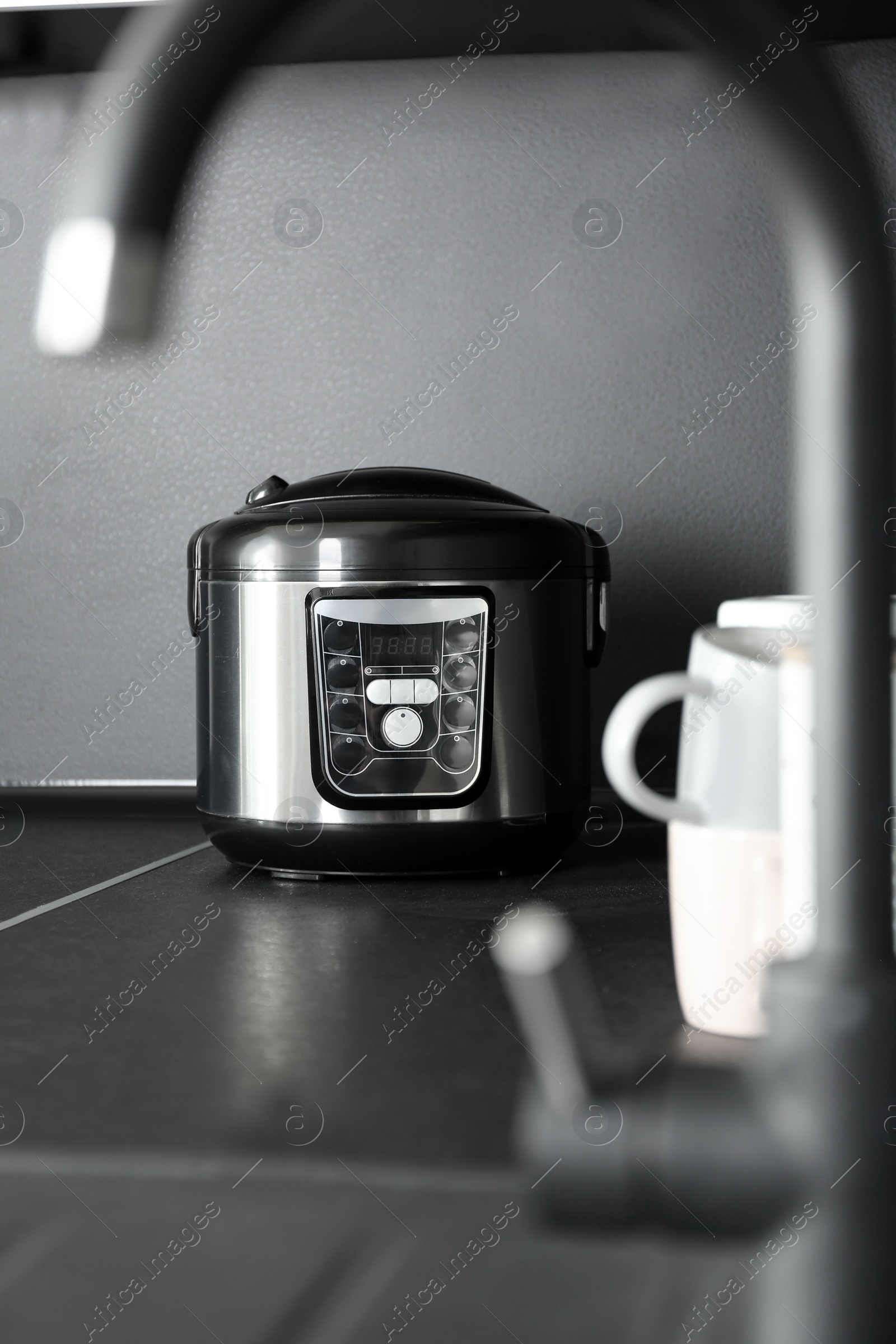 Photo of Modern multi cooker in kitchen. Domestic appliance