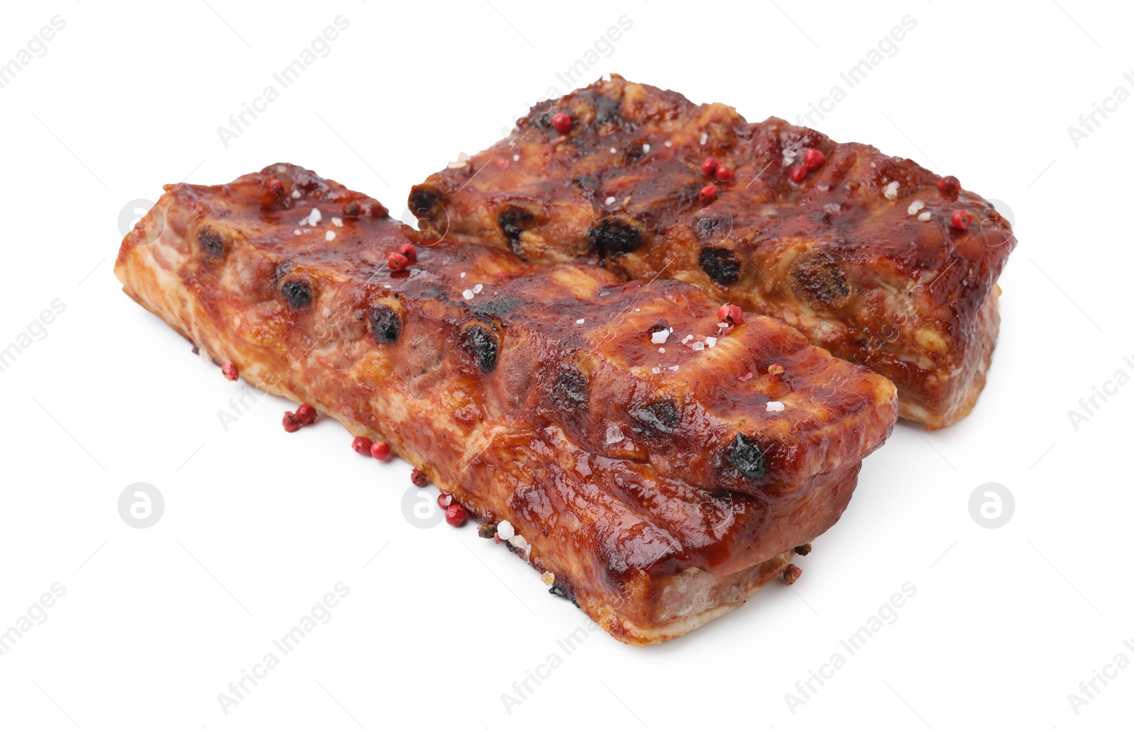 Photo of Tasty roasted pork ribs and peppercorns isolated on white