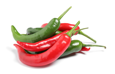 Photo of Ripe hot chili peppers on white background