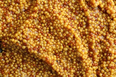 Photo of Whole grain mustard as background, top view