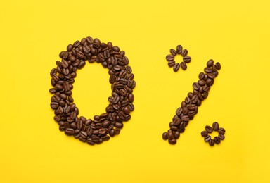 Photo of 0 percent made of coffee beans on yellow background, flat lay. Decaffeinated drink
