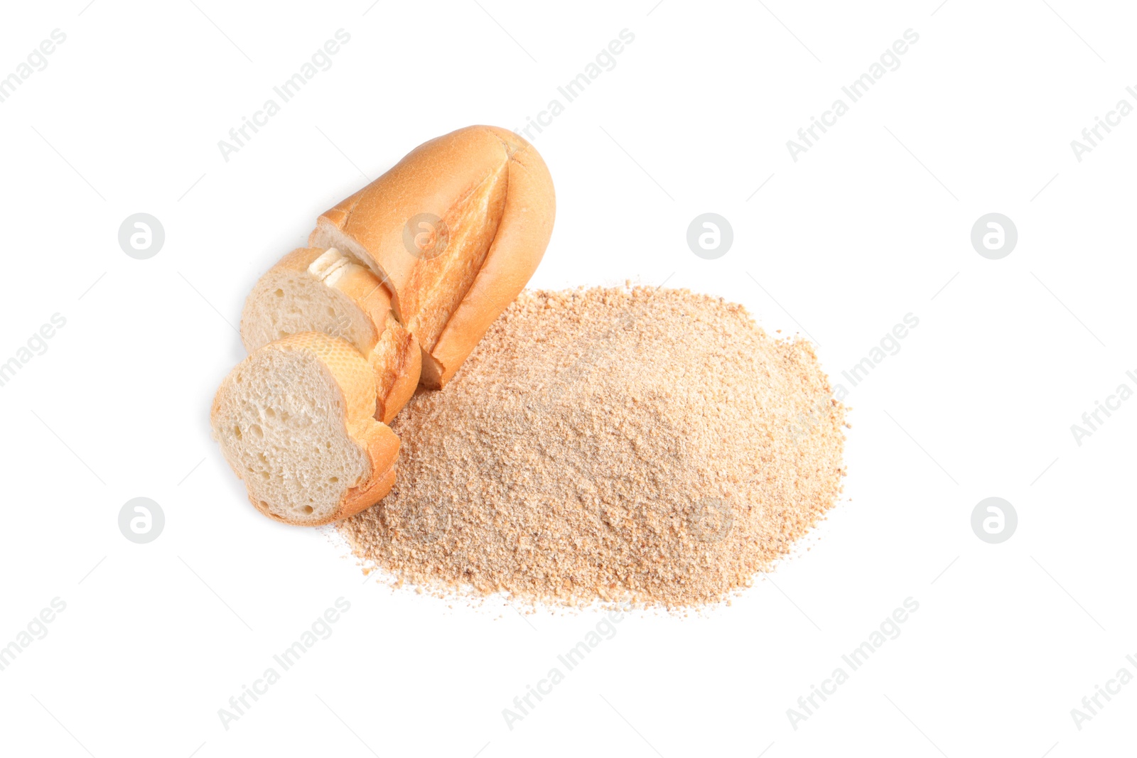 Photo of Pile of fresh bread crumbs and sliced loaf on white background, above view