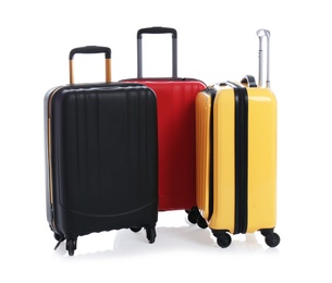 Photo of Modern suitcases for travelling on white background