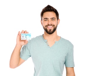 Photo of Happy young man with driving license on white background