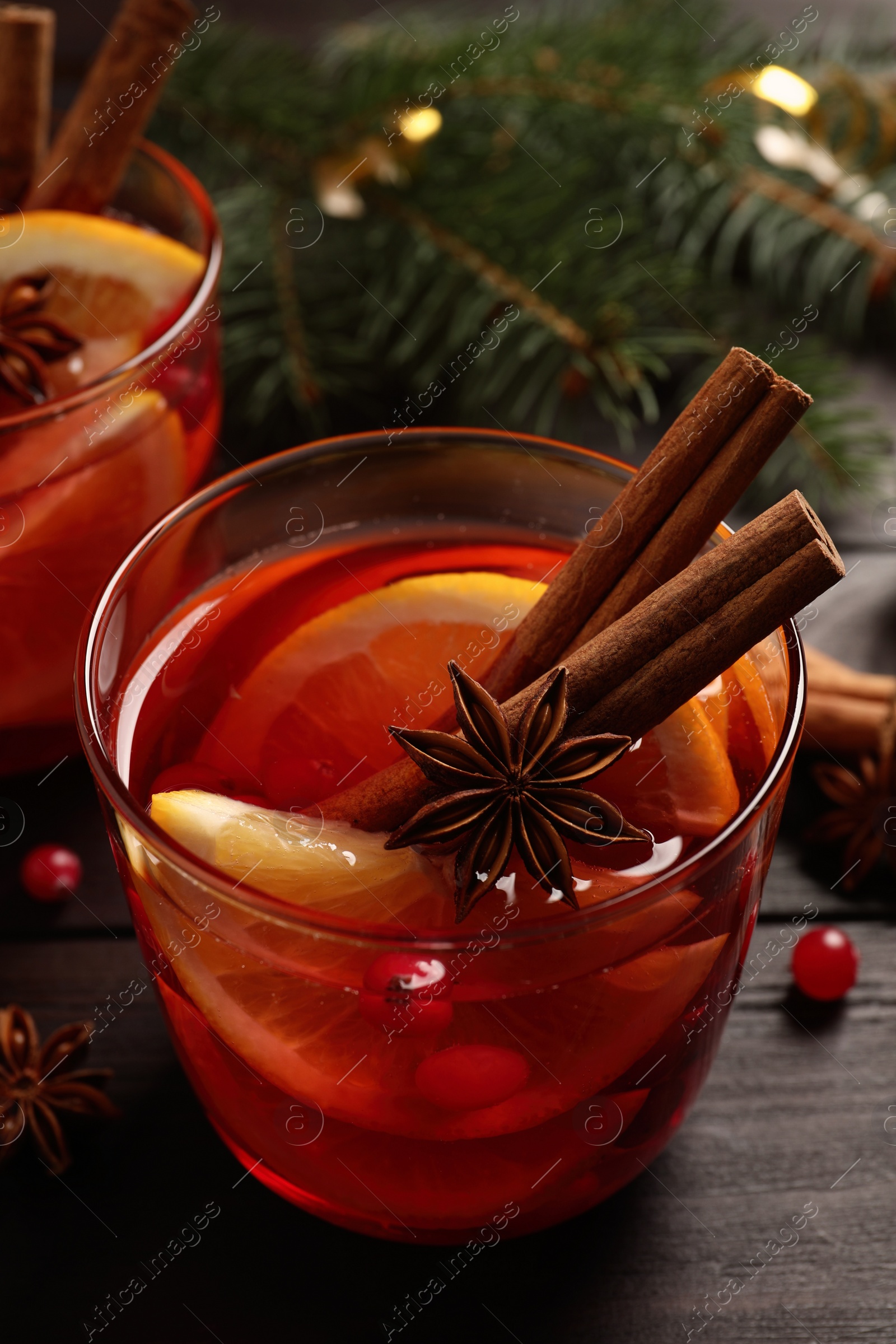 Photo of Glass with delicious punch drink on wooden table