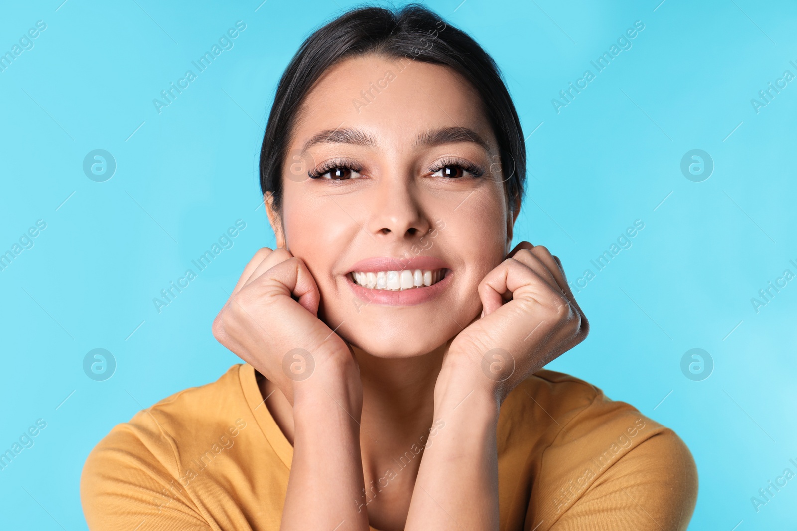 Photo of Young woman with healthy teeth on color background