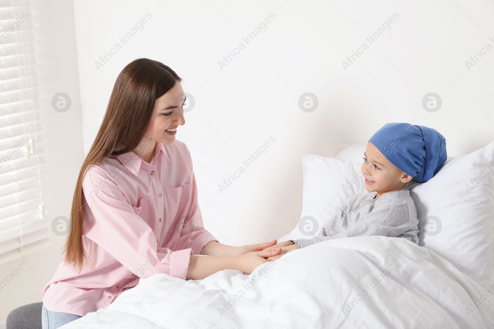 Photo of Childhood cancer. Mother and daughter in hospital