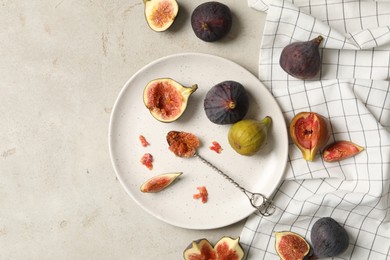 Flat lay composition with delicious figs on light grey table
