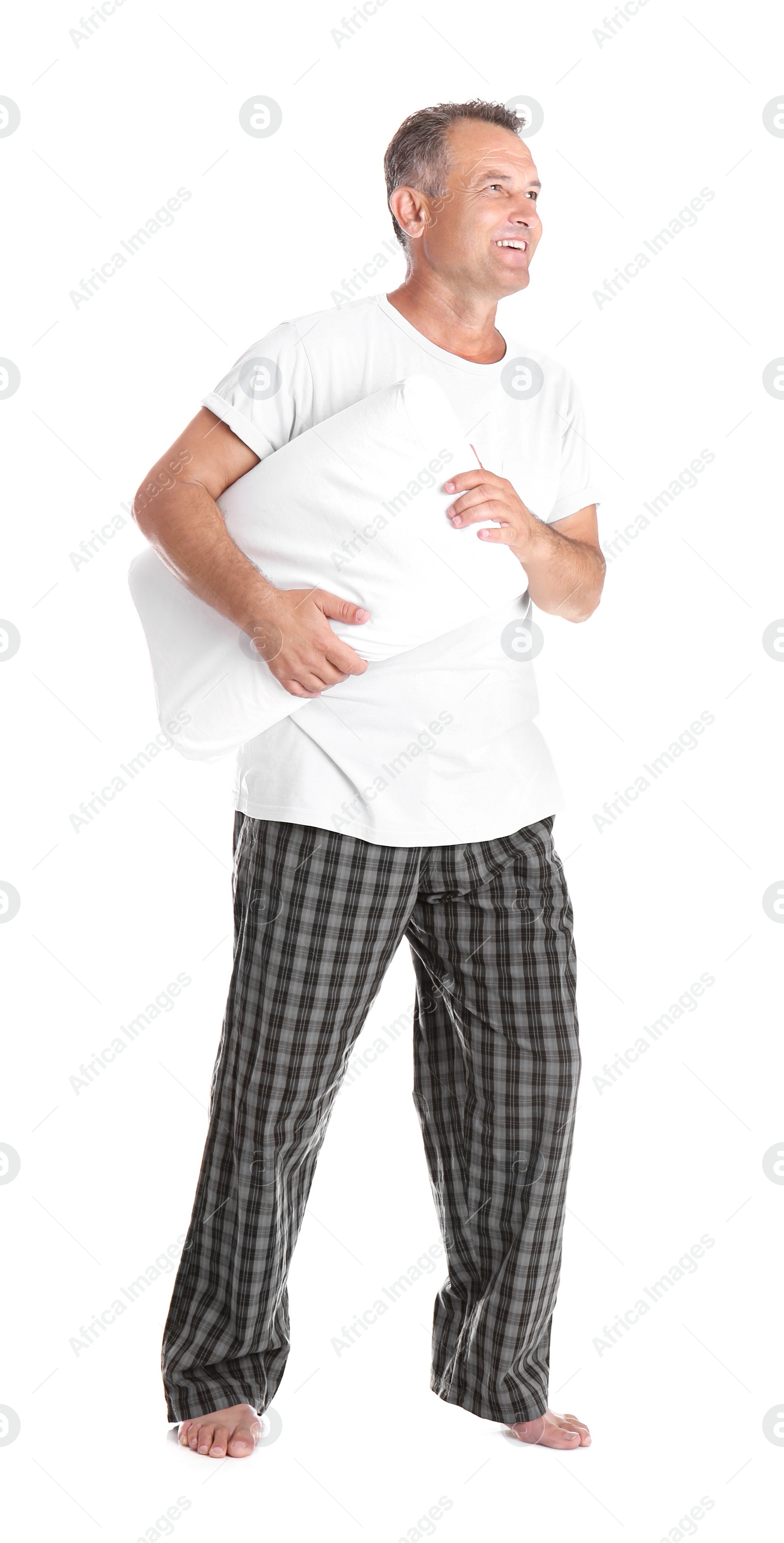 Photo of Man holding soft pillow on white background