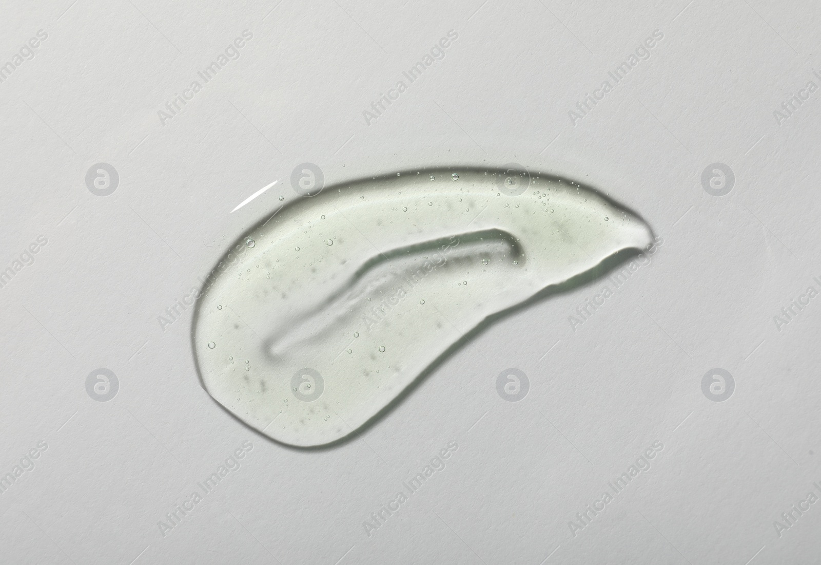 Photo of Sample of cosmetic gel on white background, top view