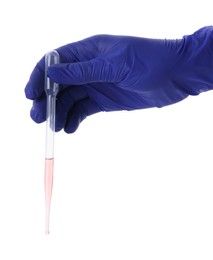 Photo of Scientist holding transfer pipette with liquid on white background, closeup
