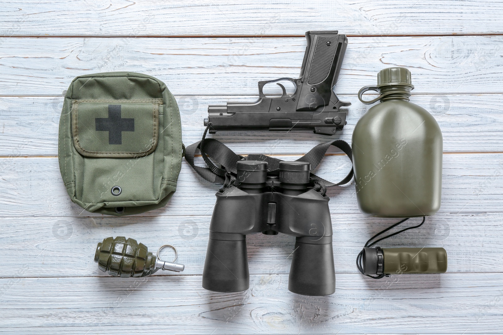 Photo of Set of military outfit on wooden background, flat lay