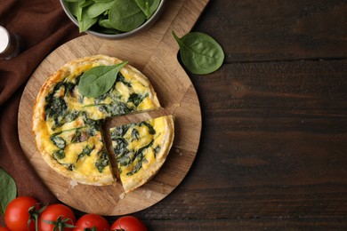 Photo of Delicious pie with spinach on wooden table, flat lay. Space for text