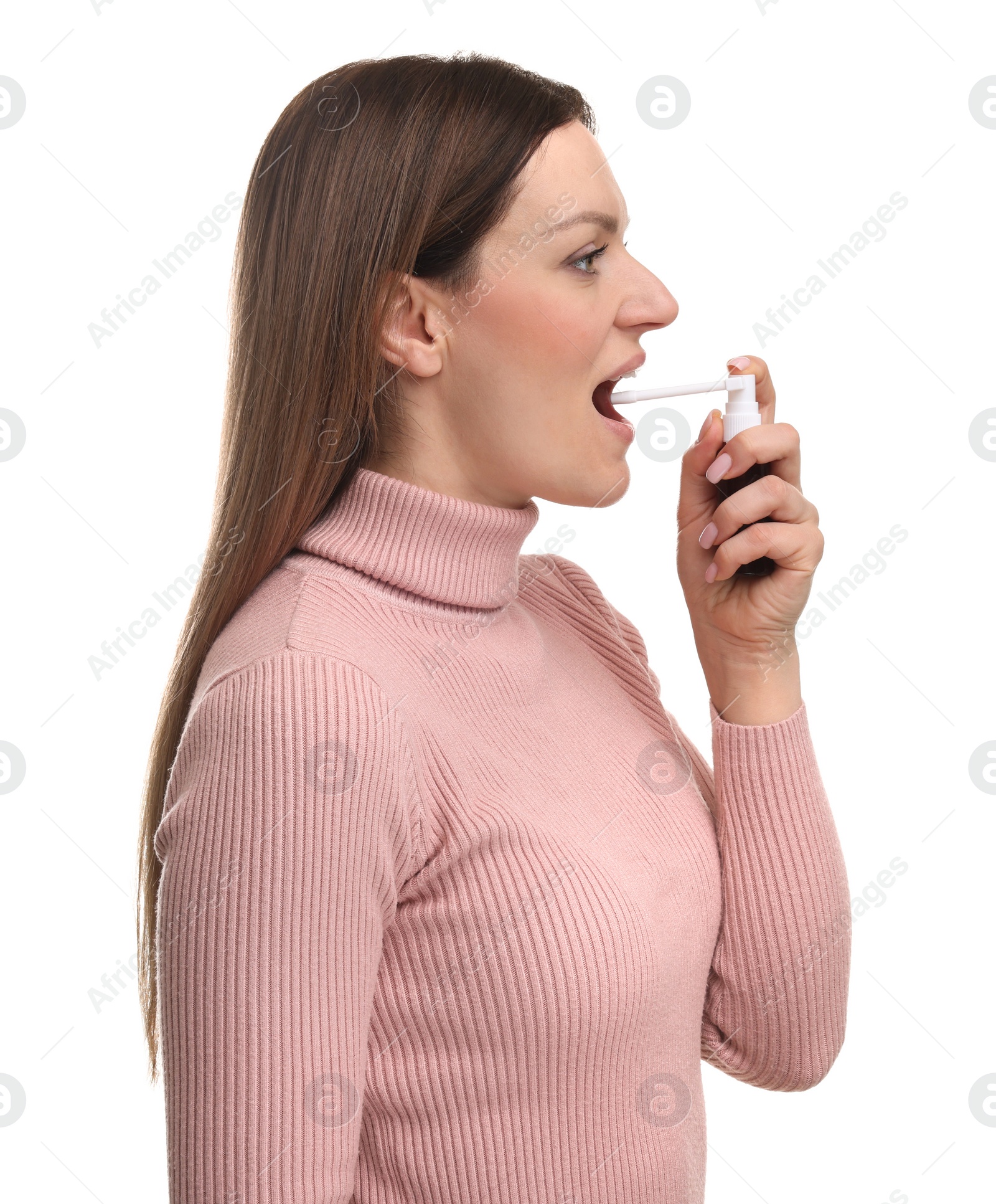 Photo of Woman using throat spray on white background