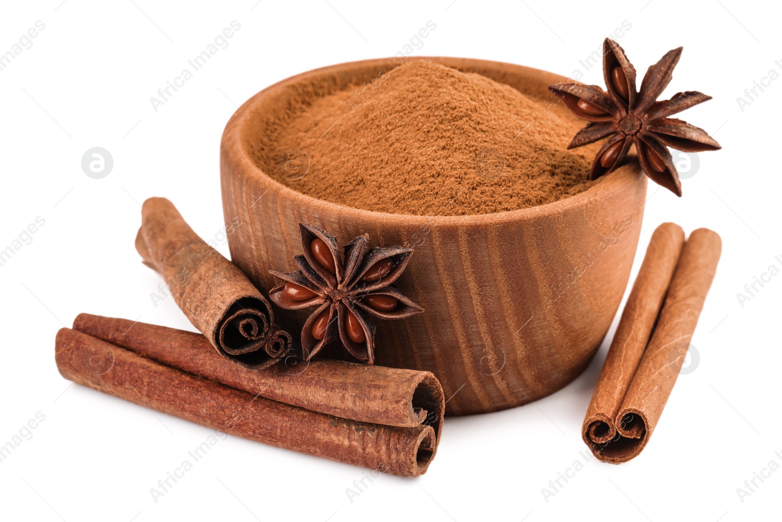 Photo of Dry aromatic cinnamon sticks, powder and anise stars isolated on white