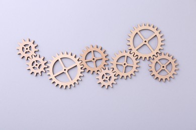 Business process organization and optimization. Scheme with wooden figures on light background, top view