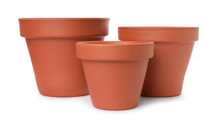 Photo of Empty clay flower pots isolated on white