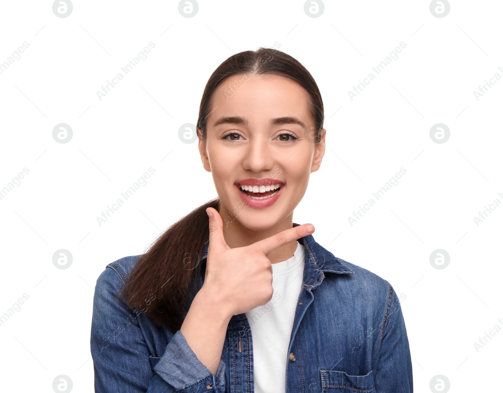 Photo of Young woman with clean teeth smiling on white background