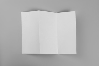 Photo of Blank paper brochure on light grey background, top view. Mockup for design