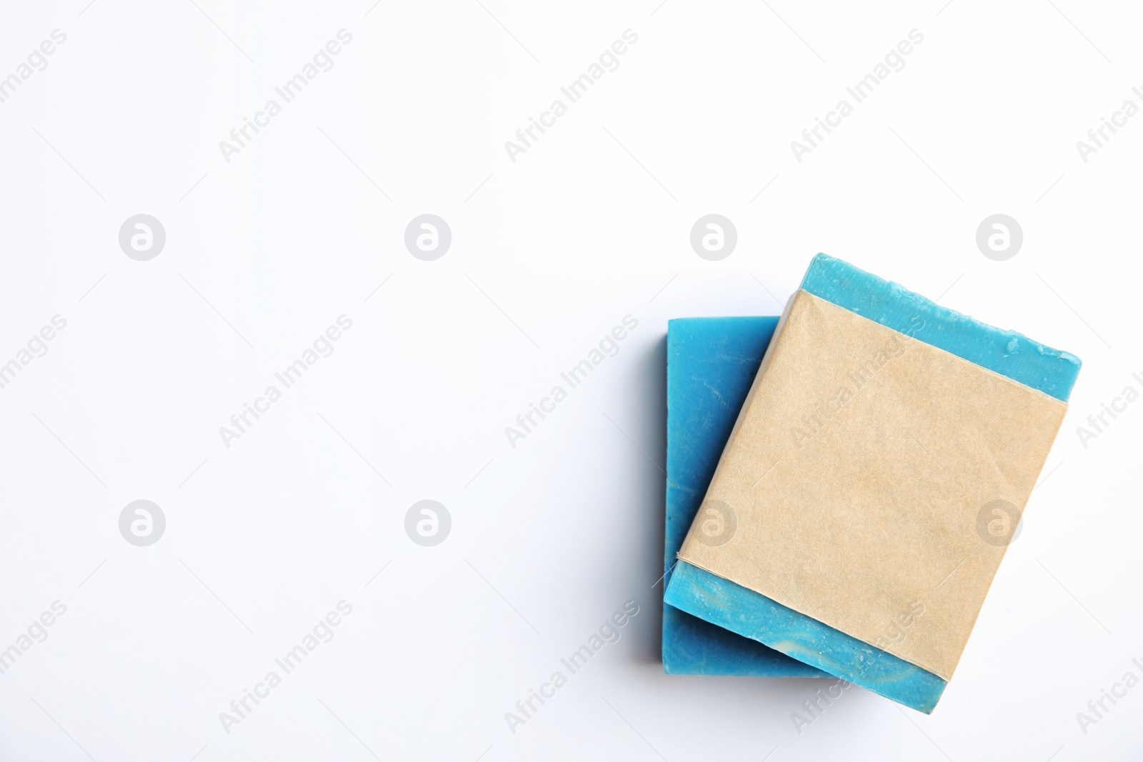 Photo of Hand made soap bars on white background, top view. Mockup for design