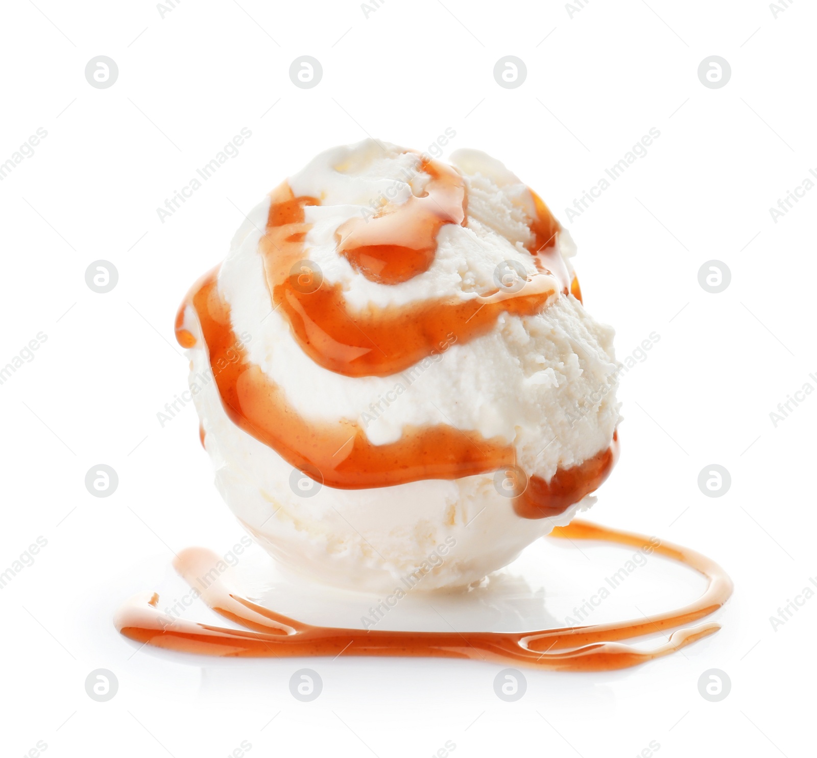 Photo of Ball of tasty vanilla ice cream with caramel topping on white background