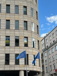 Photo of WARSAW, POLAND - JULY 17, 2022: Flags of European Union fluttering on city street