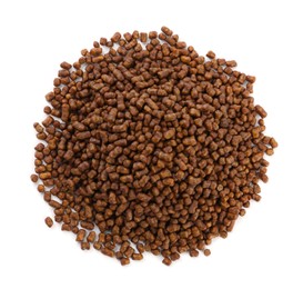 Pile of buckwheat tea granules on white background, top view