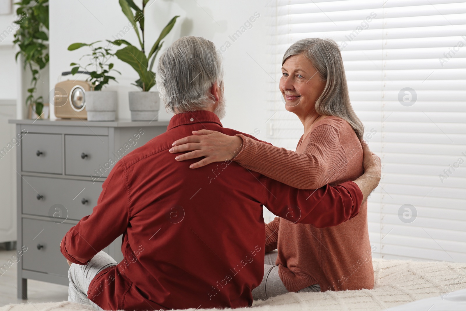 Photo of Happy senior couple spending time together at home