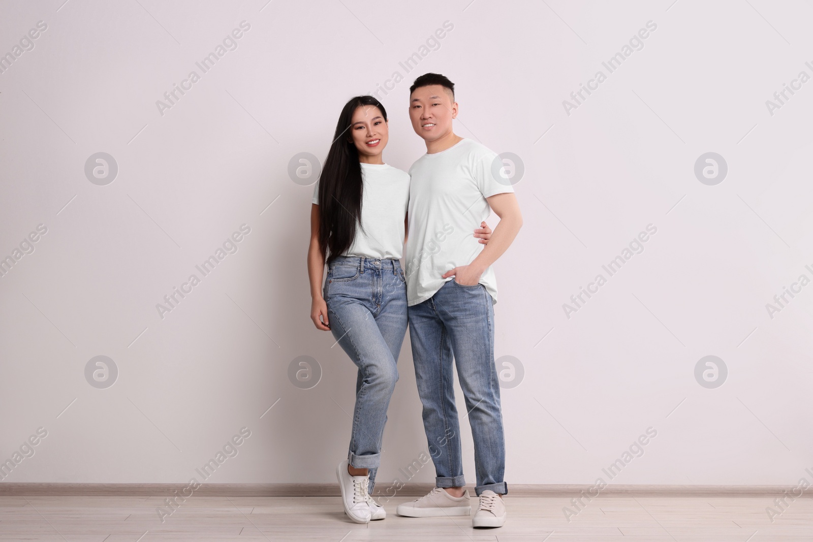 Photo of Portrait of happy couple on white background