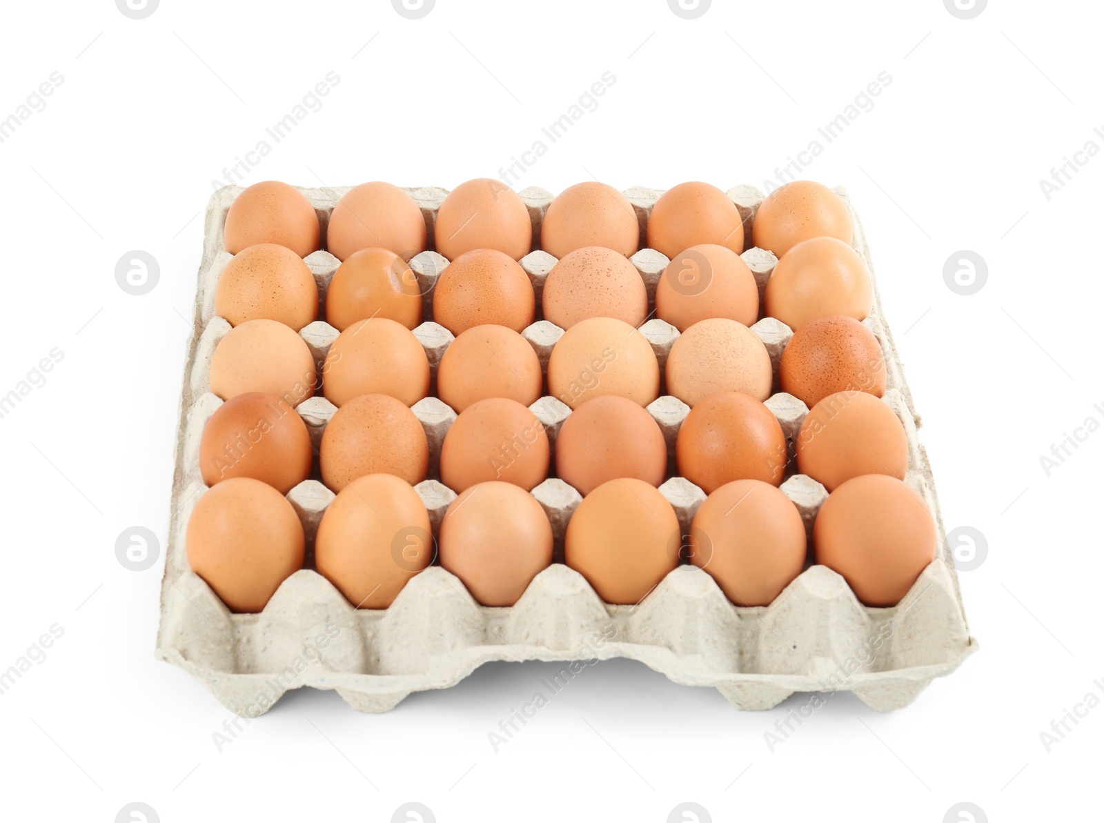 Photo of Raw chicken eggs in carton tray isolated on white