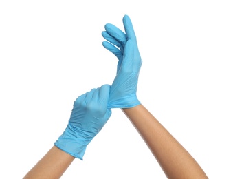 Doctor wearing medical gloves on white background, closeup