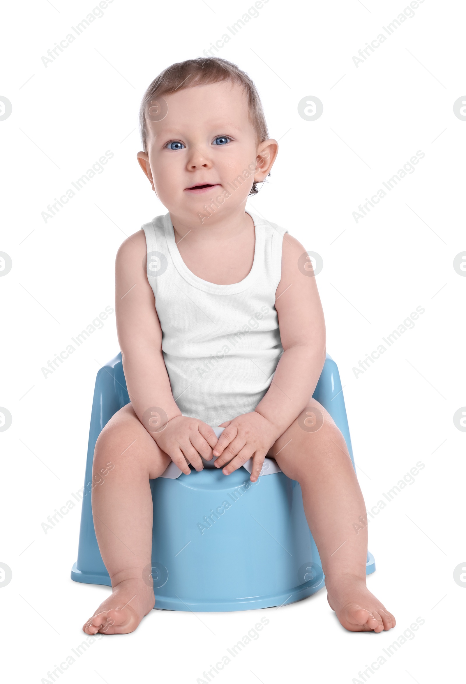 Photo of Little child sitting on baby potty against white background