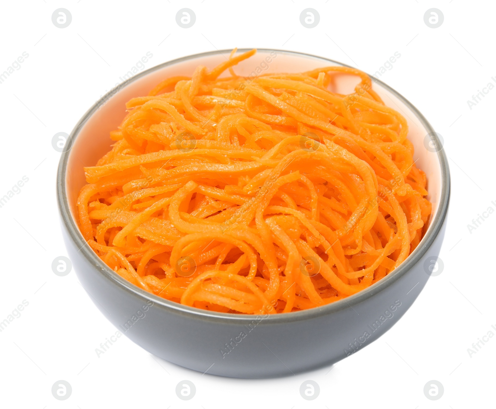 Photo of Delicious Korean carrot salad in bowl isolated on white